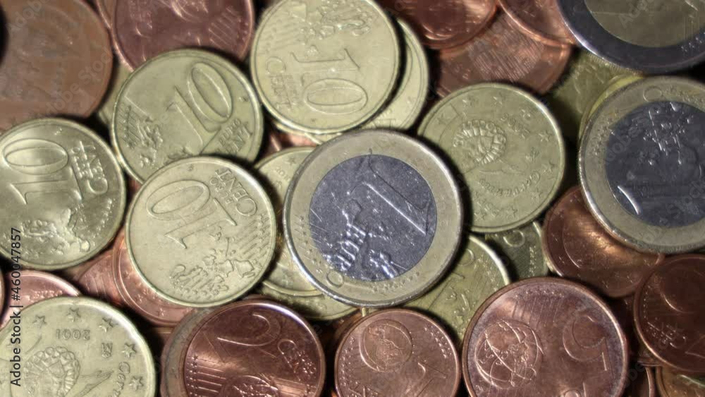 Rotating pile of Euro coins as background. Top view Rotating pile of Euro coins as background. Top view
