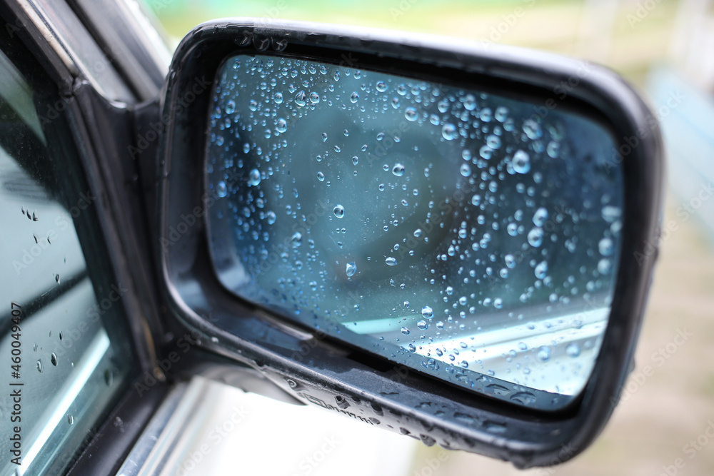 Rearview mirror with raindrops and a heart. On a retro German car. Rearview mirror with raindrops and a heart. On a retro German car.