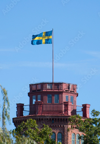 The tower Bredablick in a Stockholm park with a Swedish flag  photo