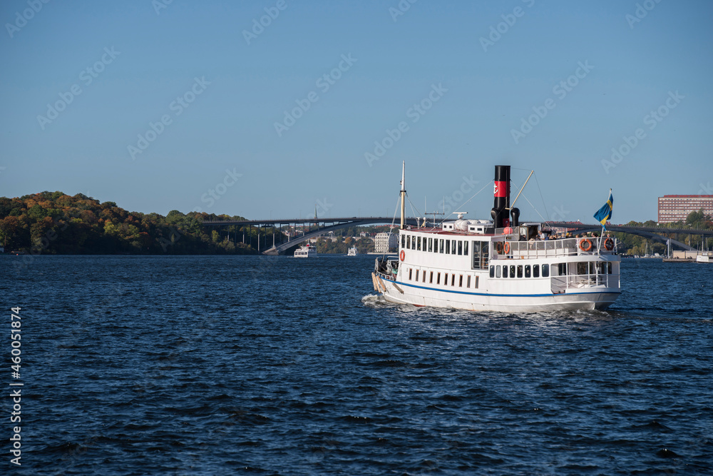 Old commuting steam boat leaving Stockholm City for the Drottningholm castle and park Old commuting steam boat leaving Stockholm City for the Drottningholm castle and park