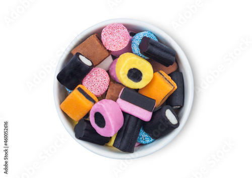 Photos Liquorice Allsorts Sweets mixed in white ceramic plate on white background