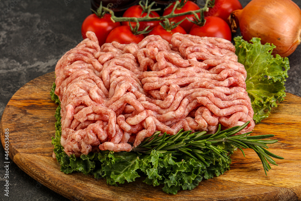 Raw pork minced meat over board Raw pork minced meat over board