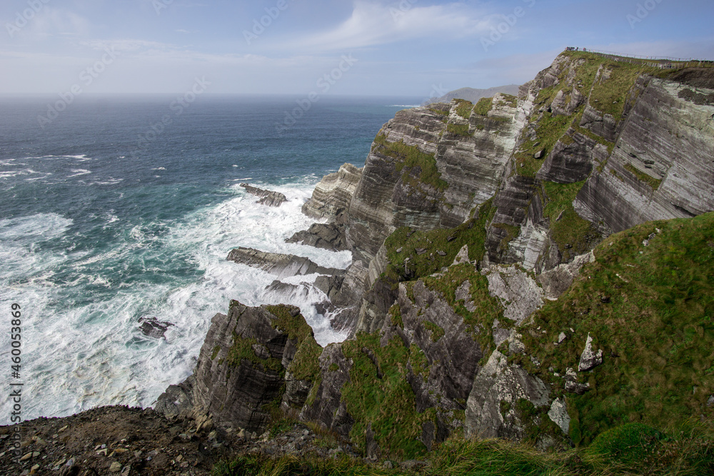 cliffs of kerry on the wild Atlantic way with blue sky and white water waves cliffs of kerry on the wild Atlantic way with blue sky and white water waves