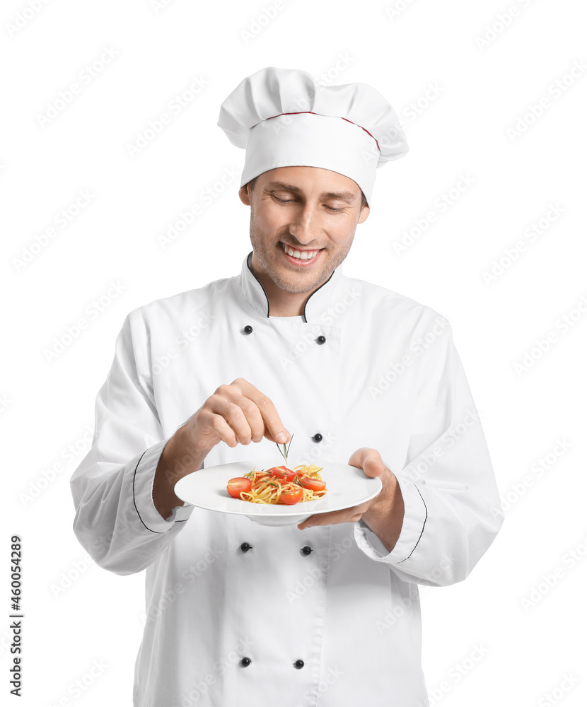 Handsome chef putting rosemary onto plate with pasta on white background Handsome chef putting rosemary onto plate with pasta on white background