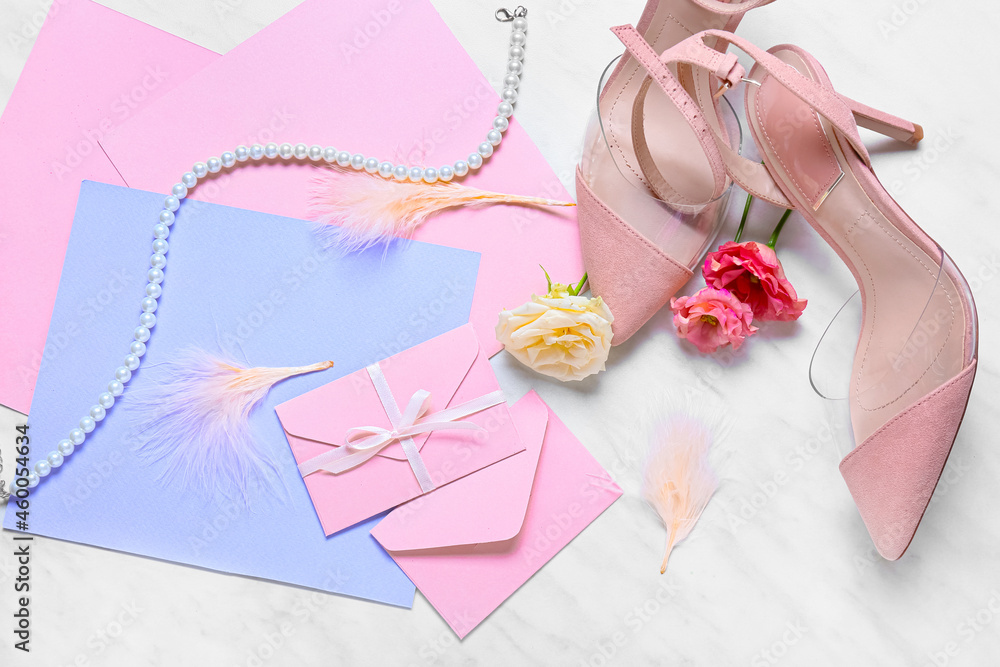 Cards with envelopes, roses and shoes on white background Cards with envelopes, roses and shoes on white background
