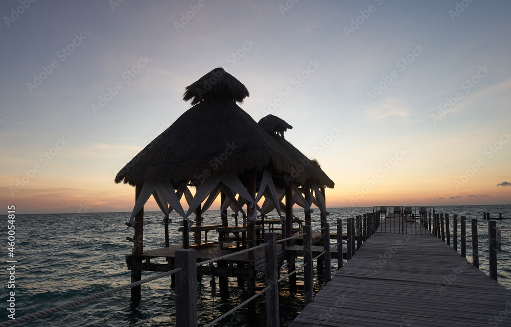 ocean bungalow at sunset