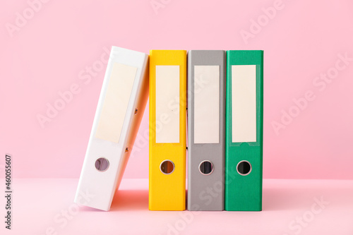 Office folders on color background photo