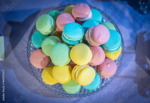 Colourful macarons on a glass platter. Party, sweet, celebration, candies 