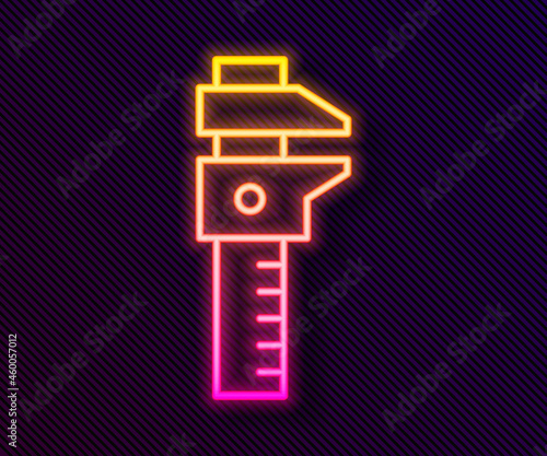 Glowing neon line Calliper or caliper and scale icon isolated on black background. Precision measuring tools. Vector