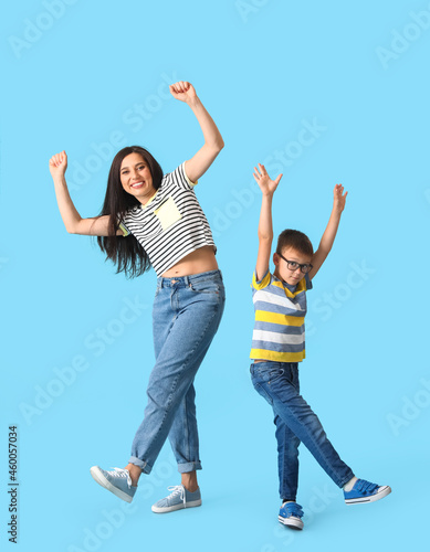Dancing young woman and her...