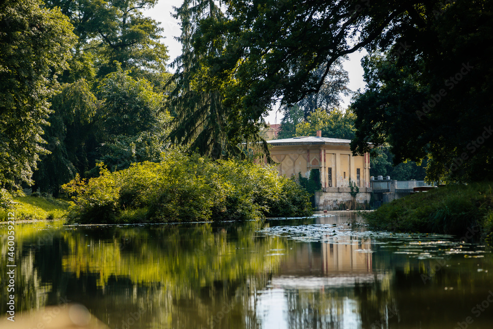Lednice, Southern Moravia, Czech Republic, 04 July 2021: chateau with beautiful gardens, parks at sunny summer day, Moorish waterworks in romantic style near water channel Dyje, oriental ornaments Lednice, Southern Moravia, Czech Republic, 04 July 2021: chateau with beautiful gardens, parks at sunny summer day, Moorish waterworks in romantic style near water channel Dyje, oriental ornaments