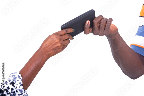 hands of a man giving a mobile phone to hands of woman.