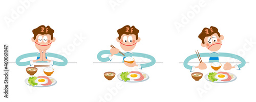 箸で食事をする男の子