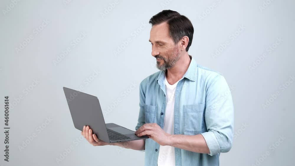 Positive freelance programmer typing laptop direct finger device Positive freelance programmer typing laptop direct finger device