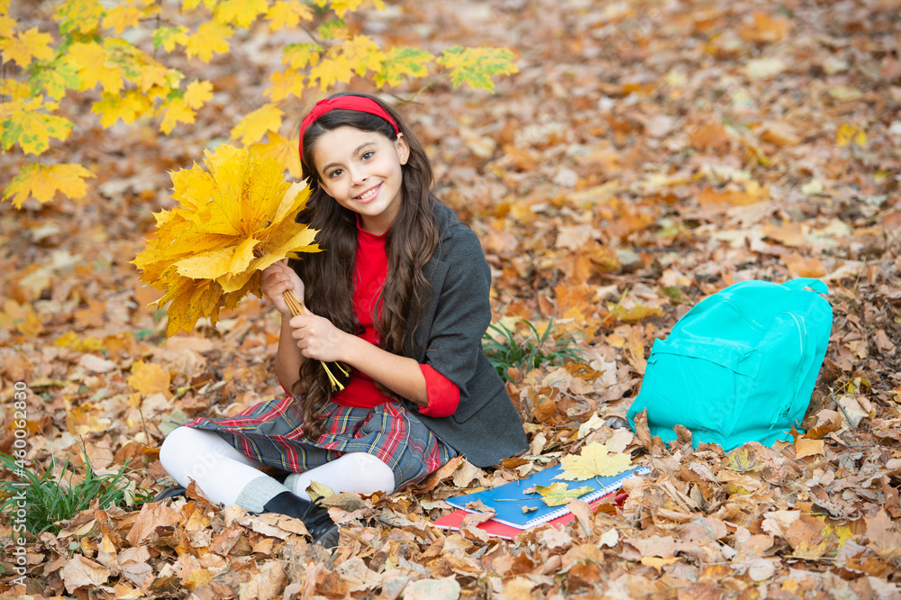 autumn nature. childhood happiness. back to school. kid with notebook. fall season fashion.