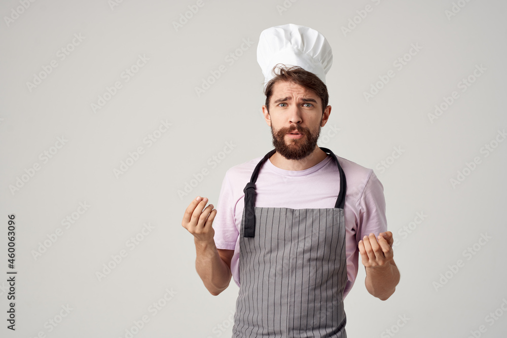 a man in a chef's uniform gesturing with his hands Professional culinary industry a man in a chef's uniform gesturing with his hands Professional culinary industry