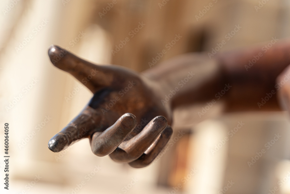  bronze statue hand reaching out with the index finger