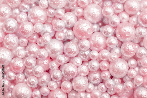 Fotografie Beautiful background pink pearl pearls, top view