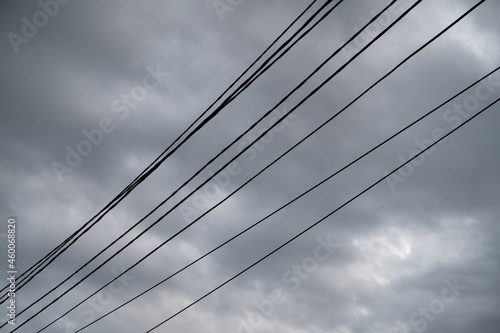 Black wires against the moody sky.