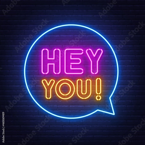 Hey you neon sign on brick wall background.