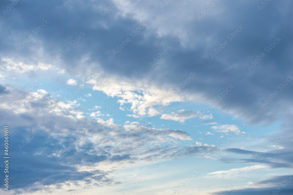 Blue sky and clouds of pastel colors