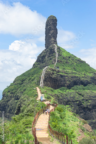 View of stairs and Tungi hill rock, Mangi Tungi, Nashik, Maharashtra, India. Prominent twin-pinnacled peak with plateau in between. photo