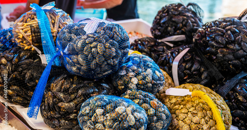 Fish Market with seafood and fish. Fresh local products sold on street. Venetian fish market. The Rialto fish market is located alongside the Grand Canal near the Rialto Bridge. Venice, Italy