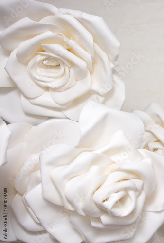 Beautiful background of the bulk of artificial paper roses.