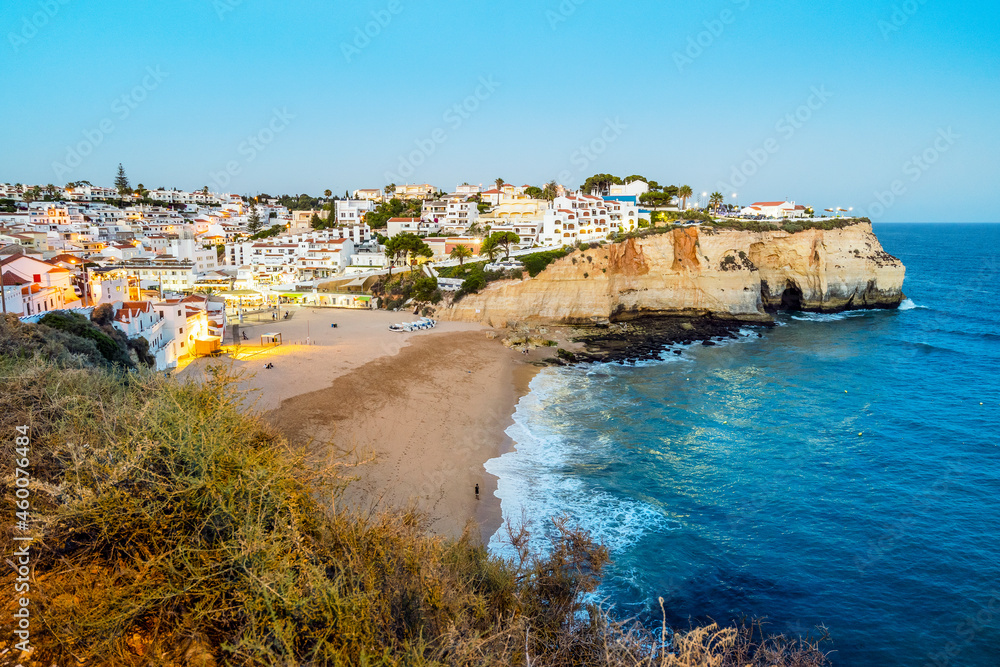 Carvoeiro cityscape with sandy beach in the evening, Algarve, Portugal