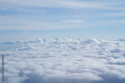 Blue and White Cloudscape view up in the sky via the airplane