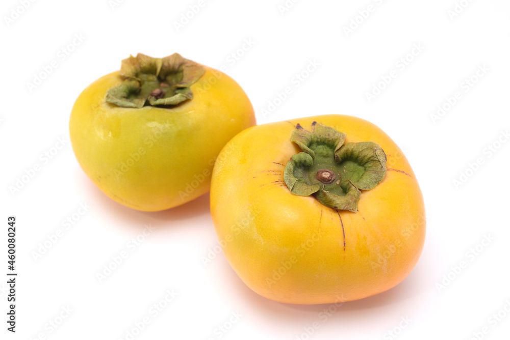 Sweet fresh ripe persimmons isolated on white background
