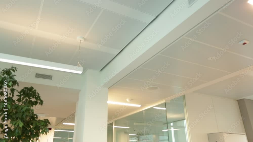modern office interior, ceiling details of a stylish and modern office. Light and metal. white office. modern office interior, ceiling details of a stylish and modern office. Light and metal. white office.