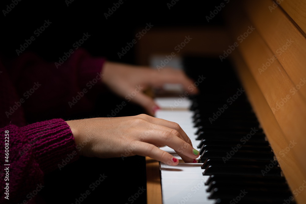 Fototapeta premium Hands of a girl playing the piano