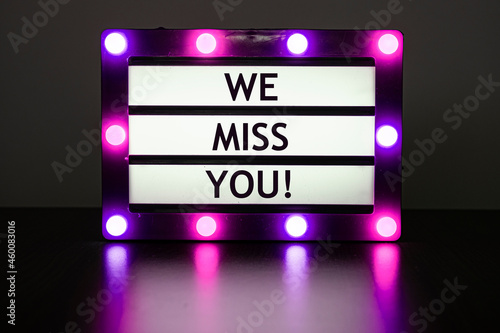 Wallpaper Mural Lightbox with pink lights in dark room with words - we miss you! Torontodigital.ca