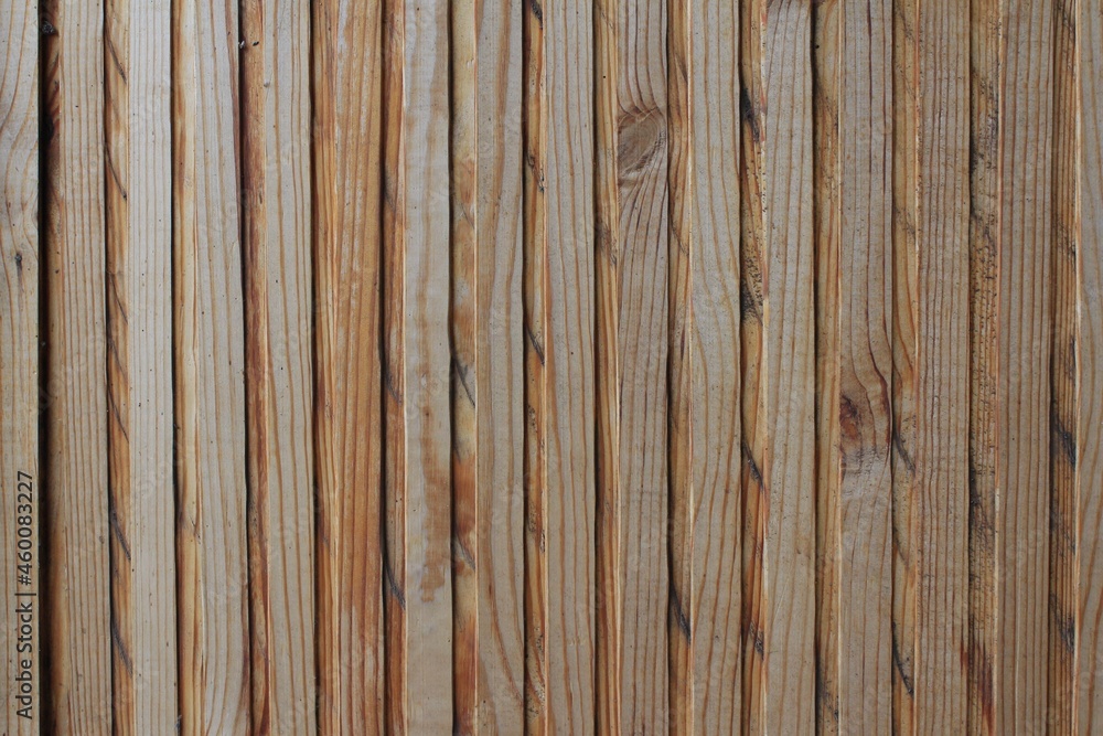 Texture of relief brown striped wooden panel - background for design Texture of relief brown striped wooden panel - background for design