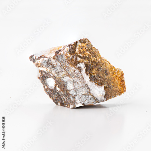 Breccia sedimentary rock macro view, isolated on white background