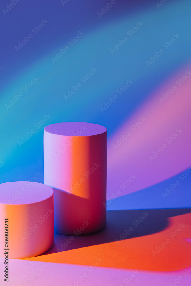 Abstract background with podiums in neon light for product presentation. Stylish geometric shapes to show products. Abstract background with podiums in neon light for product presentation. Stylish geometric shapes to show products.