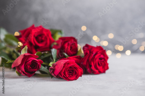 composition with beautiful red roses on light background  space for text. Valentine s Day celebration