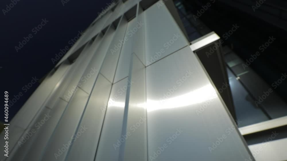 Metal Facade of a business centre in Milan, Modern architecture. The use of metals and glasses to create a design building. Metal Facade of a business centre in Milan, Modern architecture. The use of metals and glasses to create a design building.