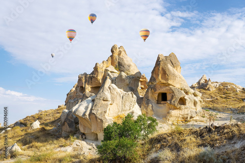 Hot air balloons flying over Goreme open air museum in Cappadocia, Turkey