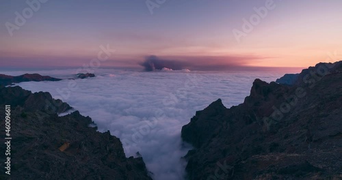 Day to night timelapse in La Palma Island during volcano eruption september 2021. Sea of clouds in caldera de taburiente and volcanic ash cloud. photo
