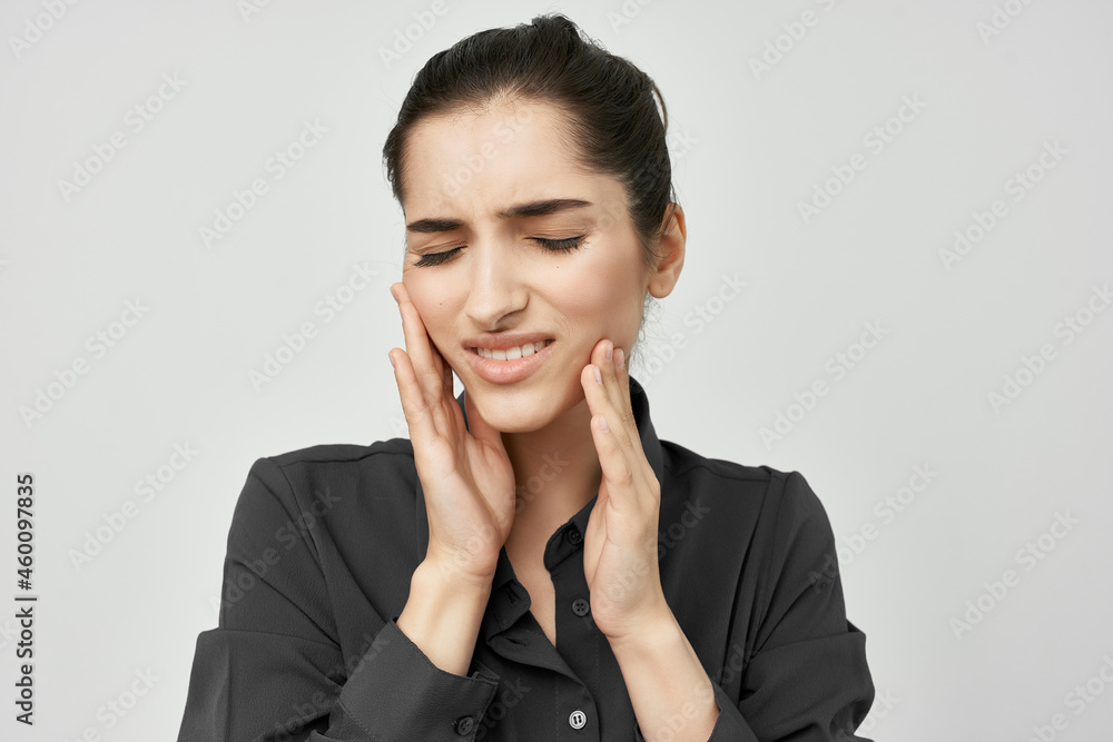 brunette in black shirt toothache health problems brunette in black shirt toothache health problems