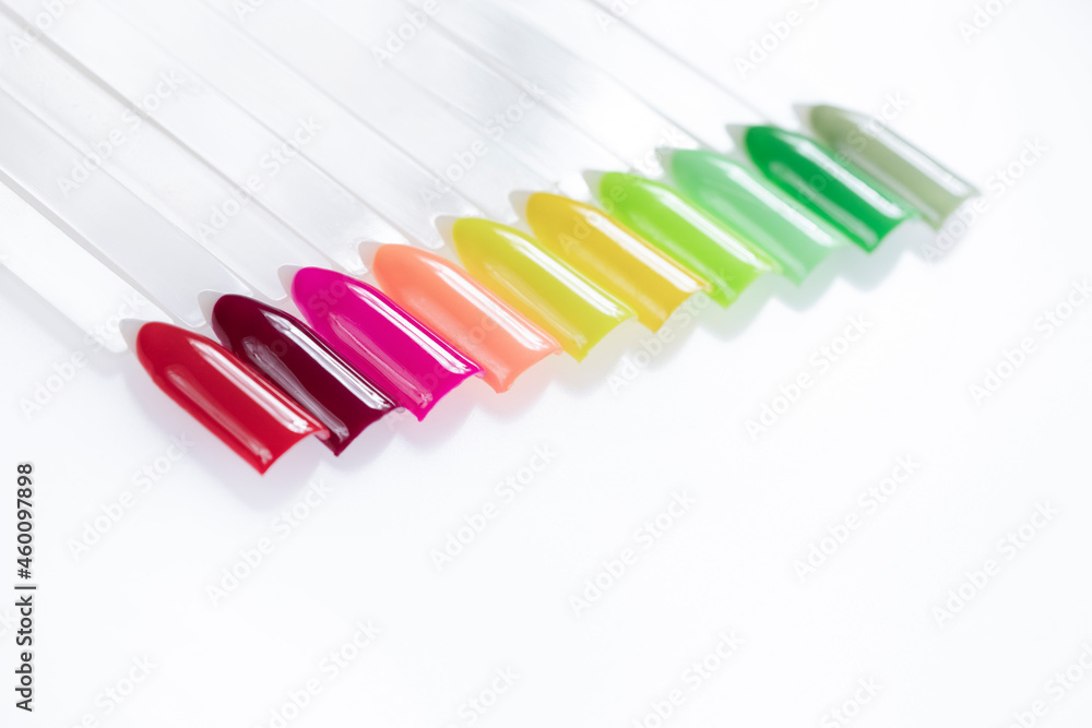 Multiсolor nail tips on a white background. examples of manicure for nails. Palette with color samples of nail. Copy space Multiсolor nail tips on a white background. examples of manicure for nails. Palette with color samples of nail. Copy space