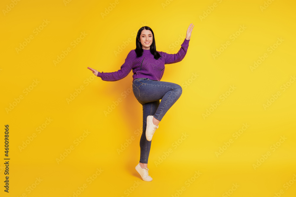 Full length body size view of nice attractive cheerful girl having fun fooling isolated on yellow color background