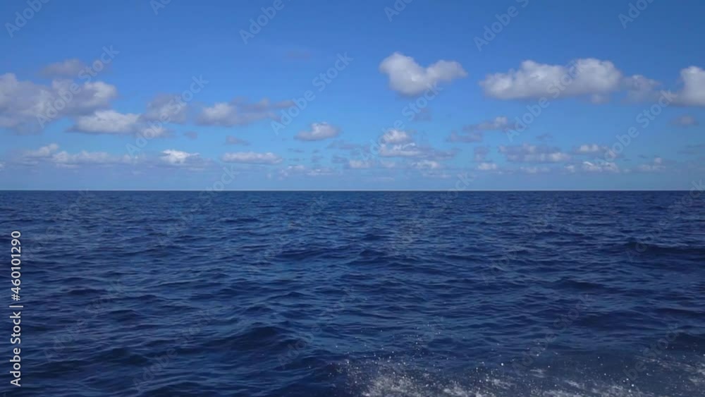 Yacht sailing at the sea of Croatia. Sailboat in windy conditions cruising clear blue ocean water. Large white Yacht with drawn sails canvas. Low-angle sea-level view of small yacht boat sailing in Yacht sailing at the sea of Croatia. Sailboat in windy conditions cruising clear blue ocean water. Large white Yacht with drawn sails canvas. Low-angle sea-level view of small yacht boat sailing in