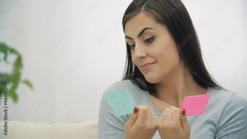 4k slowmotion video of pregnant woman holding pink and blue papers which mean gender of future baby. 4k slowmotion video of pregnant woman holding pink and blue papers which mean gender of future baby.