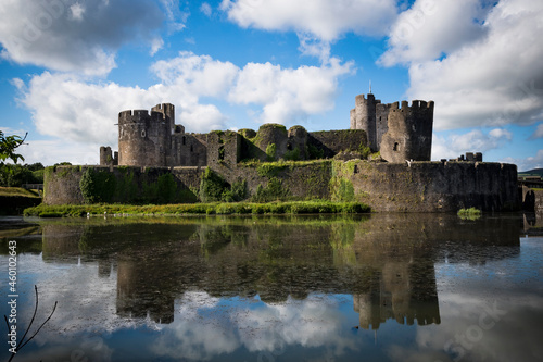 Caerphilly Castle reflected in moat in Wales