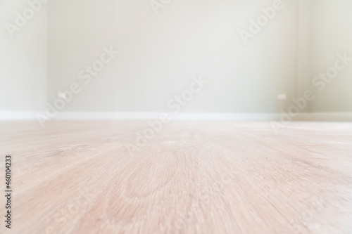 Nature brown wooden floor in the empty room with bokeh blur wall background. Selective focus. copy space for text.