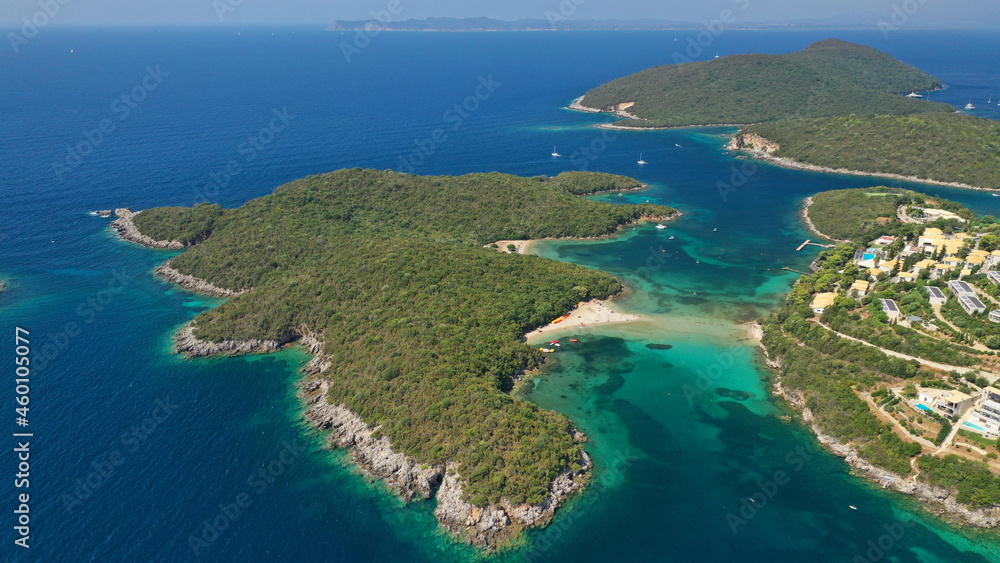 Aerial drone photo of limestone tropical exotic island bay with crystal clear turquoise sea visited by yachts and sail boats in popular paradise destination