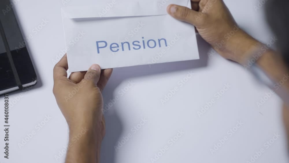 Shoulder shot of man opening received pension money from envelope - concept of retirement pension payments and savings. Shoulder shot of man opening received pension money from envelope - concept of retirement pension payments and savings.